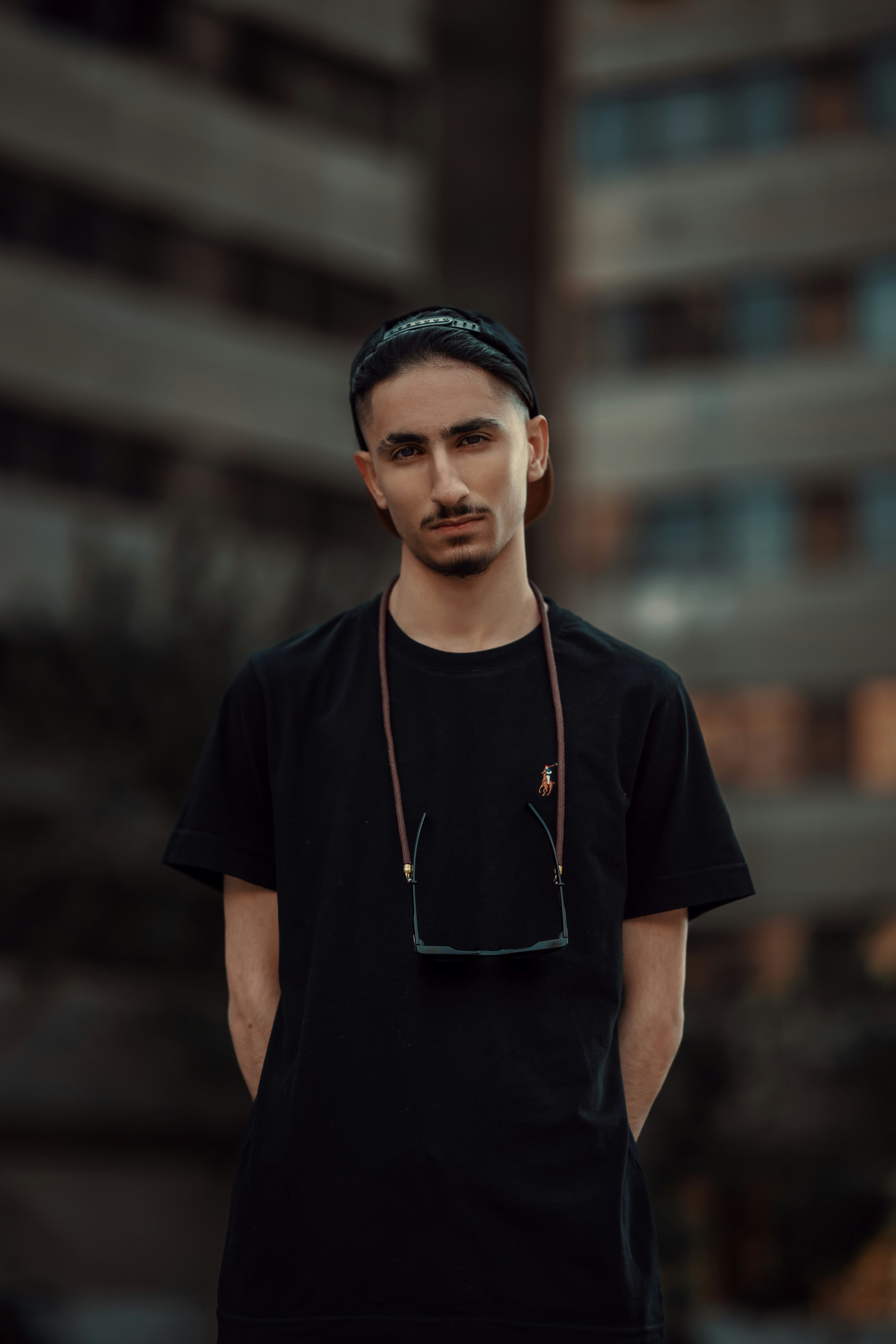 Black t-shirt with small multicolour company logo